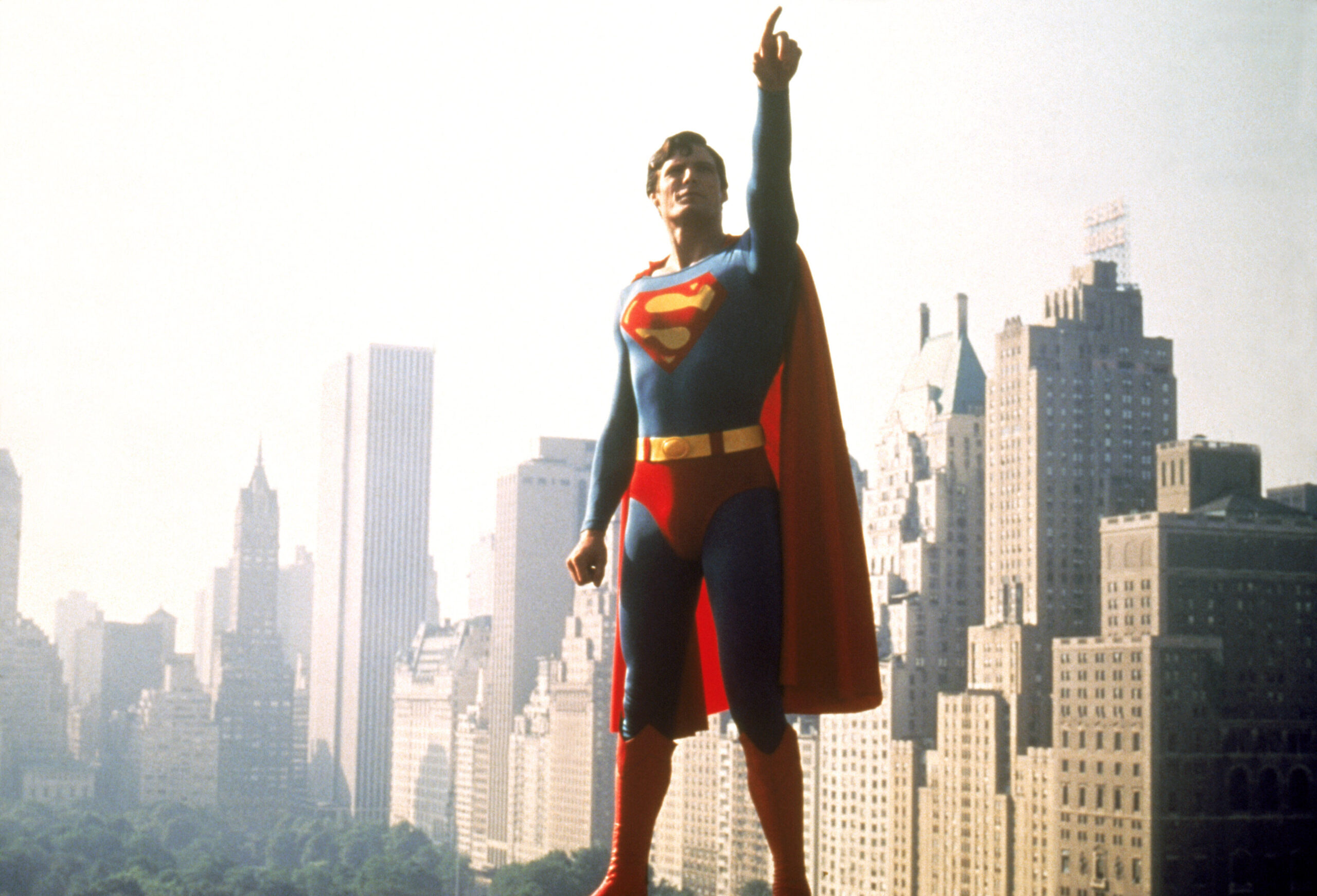 Christopher Reeve as Superman, pointing skyward